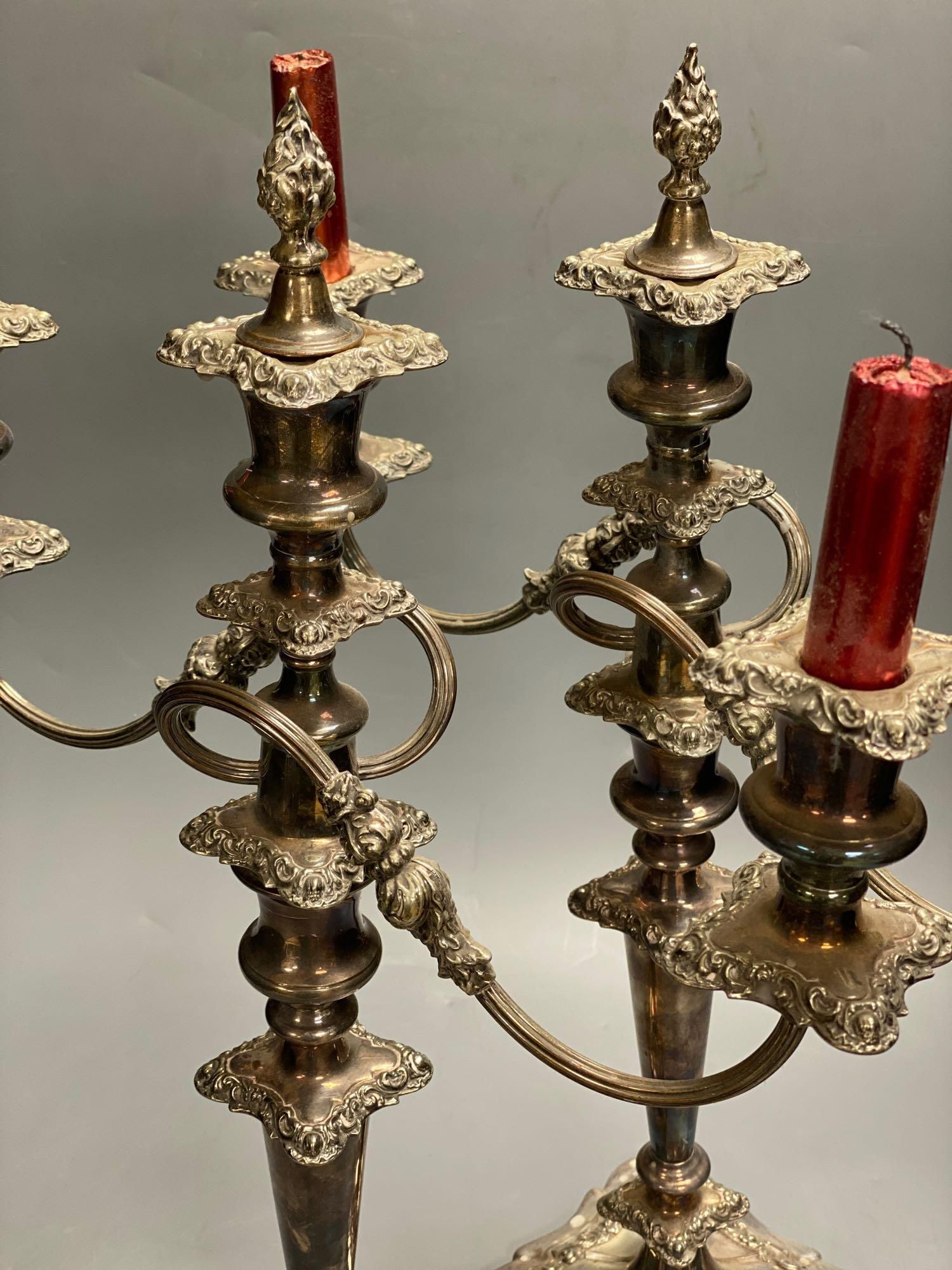 A pair of silver plated candelabra, three sconce candelabra, 51cm